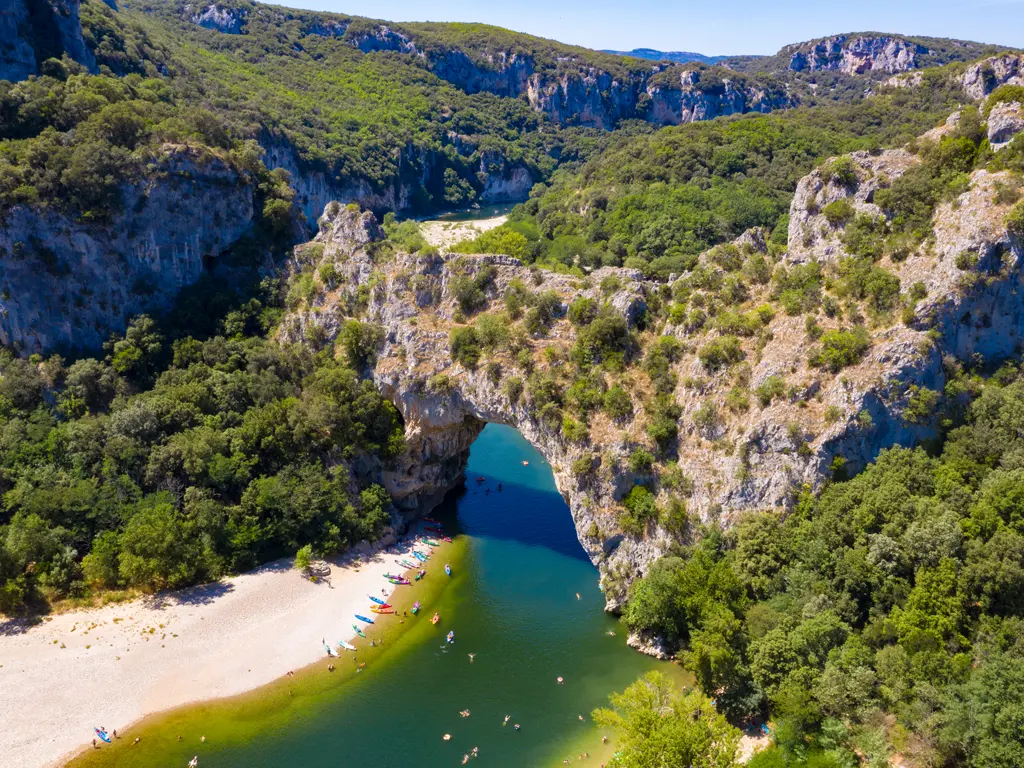 Canoe and kayak under the Pont d'Arc on the Adventure Bivouac 36 km in Ardèche, 2 days